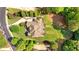 Aerial shot of a sprawling home with a large yard and lush landscaping at 13037 Overlook Pass, Roswell, GA 30075