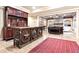 Finished basement with a decorative bar and stone fireplace at 13037 Overlook Pass, Roswell, GA 30075
