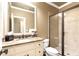 Bright bathroom with granite vanity, framed mirror, and glass-enclosed shower offering a spa-like experience at 13037 Overlook Pass, Roswell, GA 30075