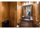 Charming powder room with antique vanity and dark wood paneling at 13037 Overlook Pass, Roswell, GA 30075