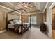 Cozy bedroom with canopy bed, stylish ceiling, and shuttered window at 13037 Overlook Pass, Roswell, GA 30075