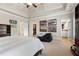 Large bedroom with neutral color scheme and a view into the Primary bath and walk-in closet at 13037 Overlook Pass, Roswell, GA 30075