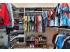 Walk-in closet features custom shelving and hanging rods for optimal organization at 13037 Overlook Pass, Roswell, GA 30075