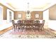 Formal dining room featuring a chandelier, hardwood floors, and ample seating at 13037 Overlook Pass, Roswell, GA 30075