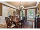 Formal dining room with decorative chandelier and large windows at 13037 Overlook Pass, Roswell, GA 30075