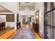Grand foyer with soaring ceilings, beautiful rug, and elegant decor, leading into the home at 13037 Overlook Pass, Roswell, GA 30075