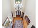 Grand foyer with chandelier, hardwood floors, and ornate rugs at 13037 Overlook Pass, Roswell, GA 30075