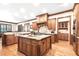 Spacious kitchen with custom cabinets, granite countertops, and a large center island at 13037 Overlook Pass, Roswell, GA 30075
