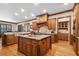Spacious kitchen with a large island, granite countertops, and wood cabinets at 13037 Overlook Pass, Roswell, GA 30075