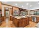 Gourmet kitchen with custom cabinetry, large island, stainless steel appliances, and breakfast bar at 13037 Overlook Pass, Roswell, GA 30075