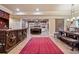 Open concept living room features tile flooring, rustic bar and an adjacent sitting area at 13037 Overlook Pass, Roswell, GA 30075