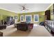 Spacious entertainment room with a TV, comfortable seating, and ample storage cabinets at 13037 Overlook Pass, Roswell, GA 30075