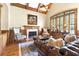 Comfortable living room with rich wood accents, a fireplace, and plush seating at 13037 Overlook Pass, Roswell, GA 30075