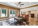 Comfortable living room with large windows, tiled floors, and natural light at 13037 Overlook Pass, Roswell, GA 30075