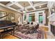 Elegant living room with coffered ceiling, fireplace, and natural light through large windows at 13037 Overlook Pass, Roswell, GA 30075