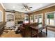 Inviting living room featuring a stone fireplace, custom built-ins, and neutral decor at 13037 Overlook Pass, Roswell, GA 30075