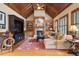 Inviting living room with vaulted wood ceiling, fireplace, built-ins, and wood floors at 13037 Overlook Pass, Roswell, GA 30075