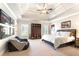 Inviting bedroom with a tray ceiling, recessed lighting, and ample space for relaxation and personalization at 13037 Overlook Pass, Roswell, GA 30075