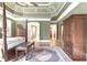 Spacious bedroom with sitting area, hardwood floors, and views into the hallway and en suite bathroom at 13037 Overlook Pass, Roswell, GA 30075