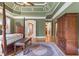 Spacious main bedroom featuring a sitting area, hardwood floors, and stylish decor at 13037 Overlook Pass, Roswell, GA 30075