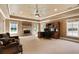 Large office with built-in desk, stone fireplace, and multiple windows for ample natural light at 13037 Overlook Pass, Roswell, GA 30075