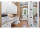 Home office featuring built-in desk, granite countertops, and storage cabinets at 13037 Overlook Pass, Roswell, GA 30075