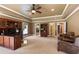 Spacious office with custom built-ins, cozy seating area, and ample natural light at 13037 Overlook Pass, Roswell, GA 30075