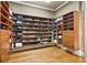 Custom walk-in closet with wood shelving and drawers for organized storage of shoes, clothes, and accessories at 13037 Overlook Pass, Roswell, GA 30075