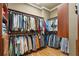 Large walk-in closet with extensive shelving and hanging space, perfect for a well-curated wardrobe at 13037 Overlook Pass, Roswell, GA 30075