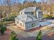 An aerial view shows the layout of a home with a well-manicured yard and private driveway at 375 Chattahoochee St, Roswell, GA 30075