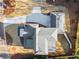 An aerial view of a home showcases its roof design, long driveway, and landscaped yard at 375 Chattahoochee St, Roswell, GA 30075