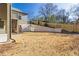 A newly seeded backyard features a brick retaining wall providing privacy and structural integrity at 375 Chattahoochee St, Roswell, GA 30075