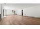 Spacious basement featuring modern flooring, recessed lighting, and staircase to upper level at 375 Chattahoochee St, Roswell, GA 30075