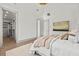 Relaxing bedroom featuring vaulted ceilings, neutral colors, and an attached walk-in closet at 375 Chattahoochee St, Roswell, GA 30075