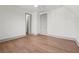 Bedroom featuring hardwood floors, ceiling fan, and two closets at 375 Chattahoochee St, Roswell, GA 30075