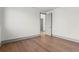 A bedroom with hardwood floors, ample natural light and gray trim around the room at 375 Chattahoochee St, Roswell, GA 30075