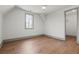 Bedroom with hardwood floors, natural light, ceiling fan, and a walk in closet at 375 Chattahoochee St, Roswell, GA 30075