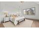 Serene bedroom with vaulted ceiling, neutral color palette, and natural light at 375 Chattahoochee St, Roswell, GA 30075