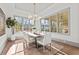 Sunlit dining room featuring neutral decor, large windows, and stylish chandelier at 375 Chattahoochee St, Roswell, GA 30075