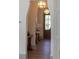 Inviting entryway with hardwood floors, decorative lighting, and a glimpse of the front door at 375 Chattahoochee St, Roswell, GA 30075