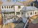 Stunning home exterior featuring a spacious deck and meticulously landscaped yard at 375 Chattahoochee St, Roswell, GA 30075