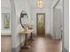 Light-filled foyer featuring hardwood floors, decorative table with lamps, arched entryways and views to the exterior at 375 Chattahoochee St, Roswell, GA 30075