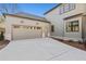 An attached two-car garage offers ample parking with stylish carriage doors and exterior lighting at 375 Chattahoochee St, Roswell, GA 30075