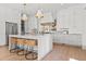 Modern kitchen features white cabinetry, marble countertops, and stainless steel appliances at 375 Chattahoochee St, Roswell, GA 30075