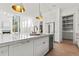 Bright kitchen with white cabinets, stainless steel appliances, and marble countertops at 375 Chattahoochee St, Roswell, GA 30075