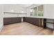 Bright kitchenette area featuring custom cabinetry, countertop space, and large window views at 375 Chattahoochee St, Roswell, GA 30075