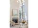 Bright living room features a fireplace, high ceilings, and large windows at 375 Chattahoochee St, Roswell, GA 30075
