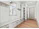 Well-organized mudroom with built-in bench seating, storage drawers, and coat hooks at 375 Chattahoochee St, Roswell, GA 30075