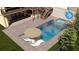 Aerial shot of backyard pool with sun loungers and spa, surrounded by landscaping at 375 Chattahoochee St, Roswell, GA 30075