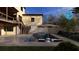Backyard pool and patio area with an umbrella and chairs, set against the backdrop of the house at 375 Chattahoochee St, Roswell, GA 30075